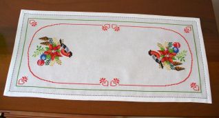 Corsia con pettirosso e stella di natale