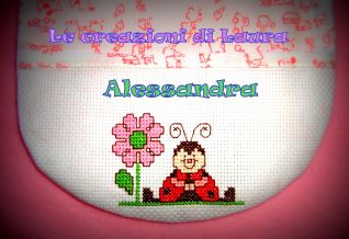 BAVAGLINO BIMBA con coccinella+fiore (dettaglio)