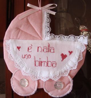 FIOCCO NASCITA CARROZZINA