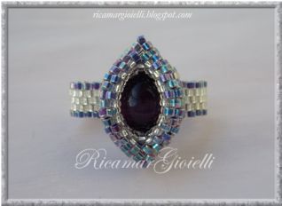 Anello doppio ovale con perla occhi di gatto viola_1
