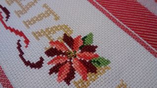 Particolare strofinaccio con stelle di natale