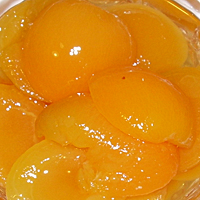 Pere, mele, albicocche sciroppate