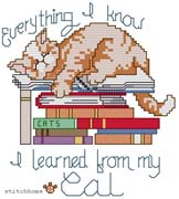 Schema punto croce gatto dorme su libri